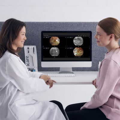 iCare_ALTIUS_doctor_and_patient_discussing_infront_of_a_screen_1080x1080-768x768